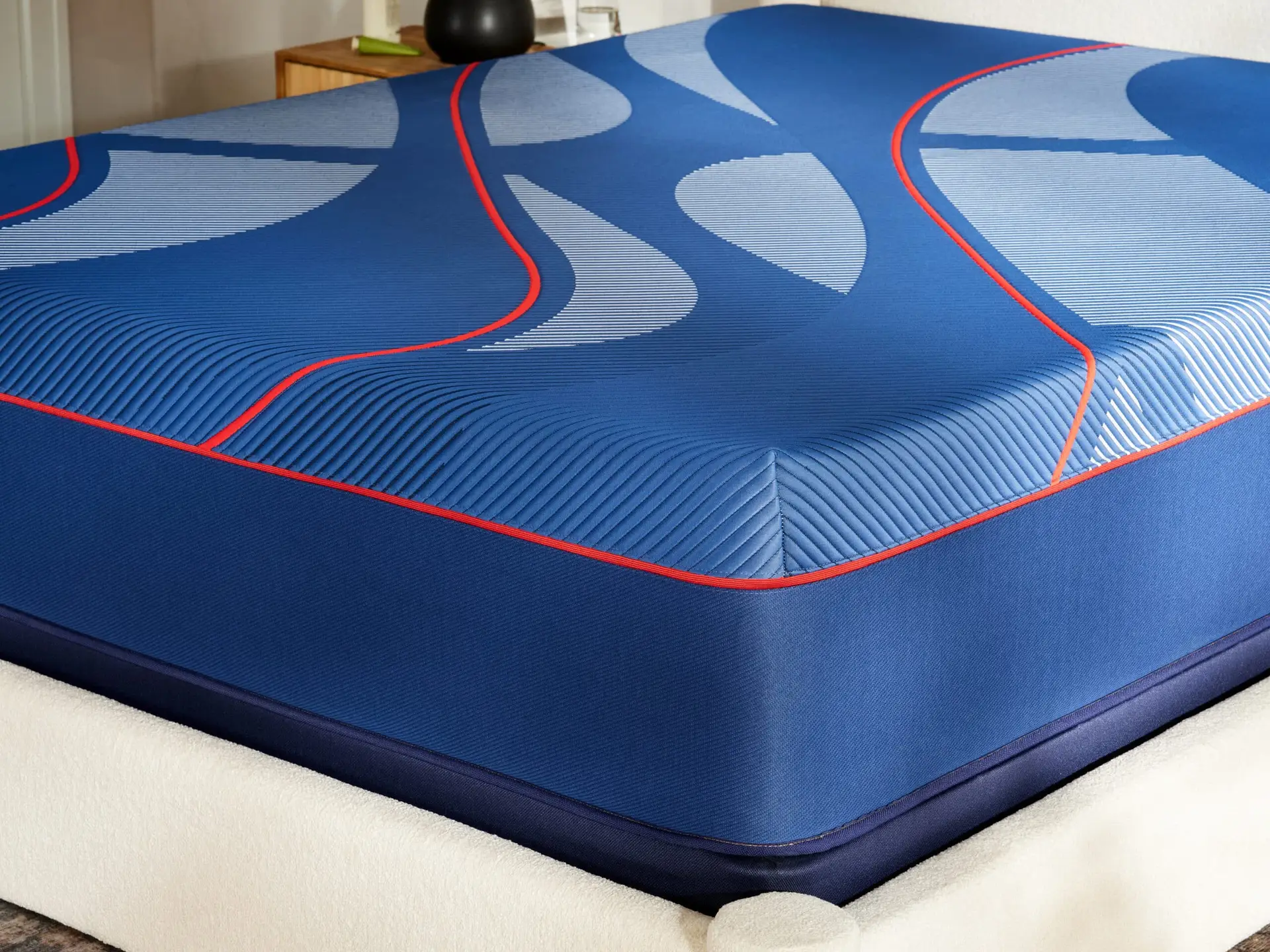 Sealy Albany II Medium Hybrid mattress showcasing blue and gray design elements, emphasizing plush comfort and support features.