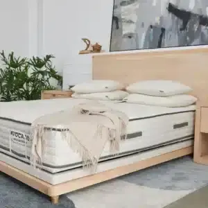 Avocado Eco Adjustable Base with split California king mattress, featuring natural materials, modern design, and cozy bedding in a stylish bedroom setting.