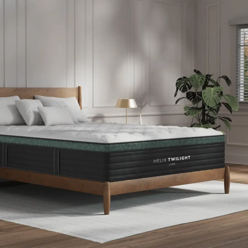 Helix Twilight Luxe mattress displayed in a stylish bedroom setting with decorative pillows, wooden bed frame, and plants, showcasing premium sleep solutions available at Healthy Zzz’s Sleep Store in Hamilton, OH.