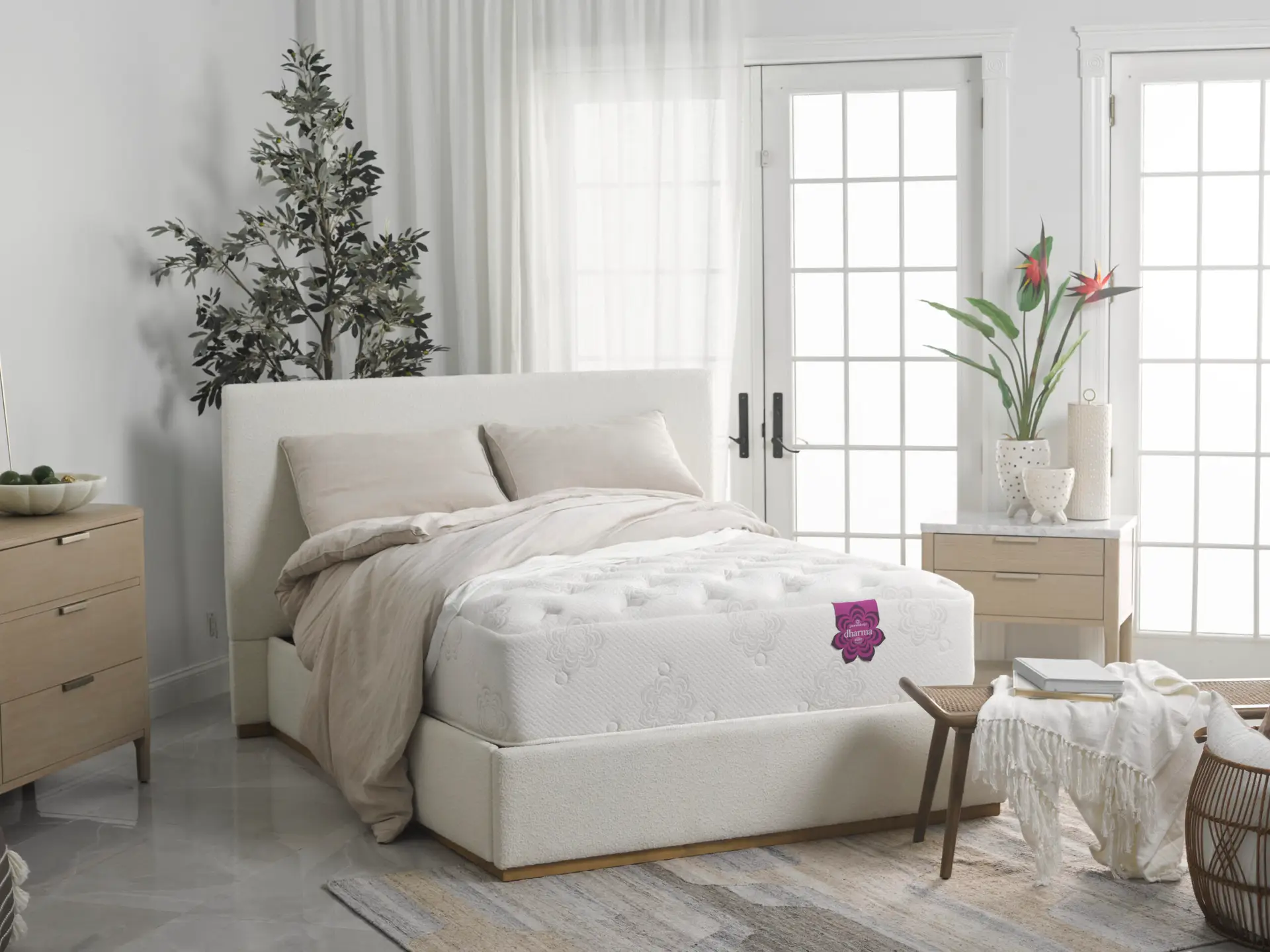 Pranasleep Dharma Elite Hybrid 1 PranaSleep Dharma Elite Hybrid mattress displayed on a modern bed in a bright room, featuring natural materials, plush bedding, and decorative plants.