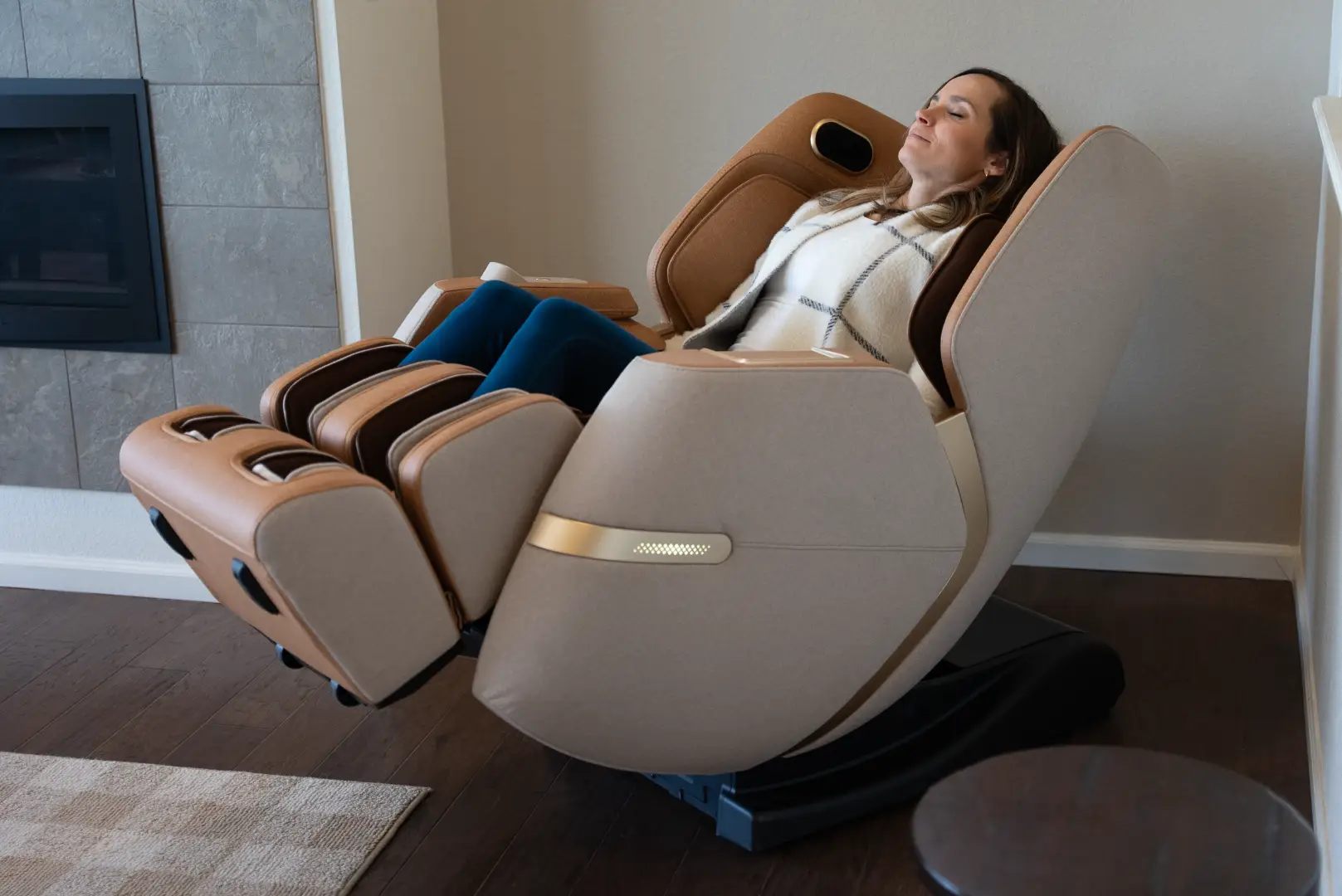 Positive Posture Solara 12 Woman relaxing in Positive Posture Solara massage chair, showcasing its ergonomic design and luxurious comfort in a modern living space.